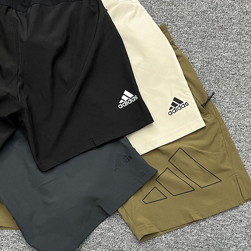 Adidas Men's Outline Logo Training Shorts – Lightweight Athletic Running Shorts with Zip Pockets